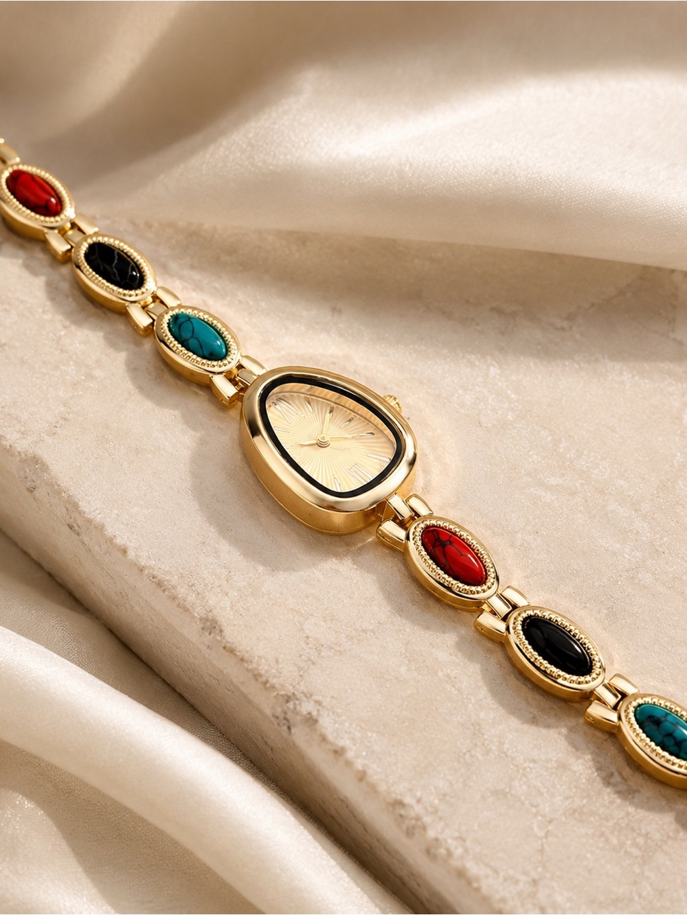 Gold Teardrop Dial Bracelet Watch with Red, Black and Turquoise Accents